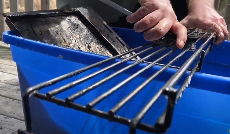 Scrubbing the grill grates