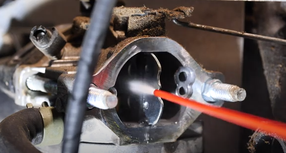 Cleaning the carburetor.