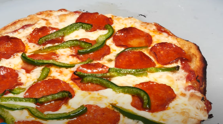 The final reveal - a perfectly grilled pizza