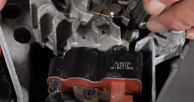 Checking the cap between the magnetic coil and the flywheel