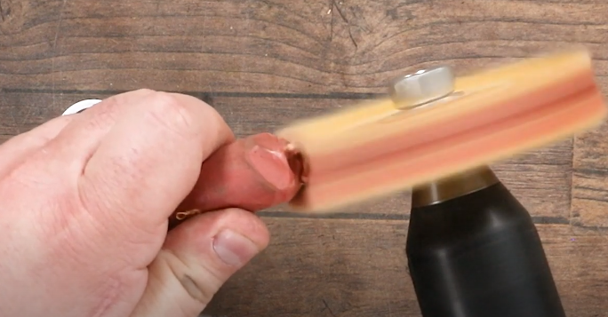 Apply compound to buffing wheel