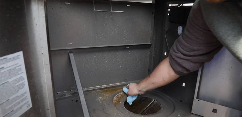 Cleaning the bottom of inner cabinet of the grill