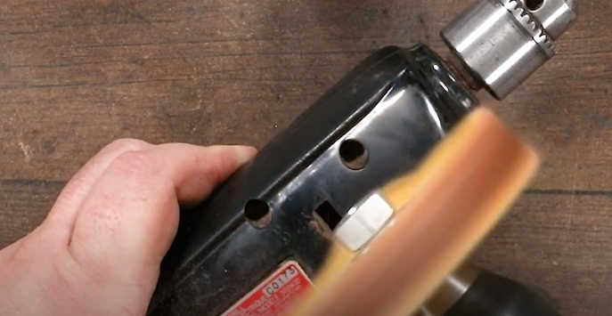 Use the buffing wheel to buff the plastic on the tool