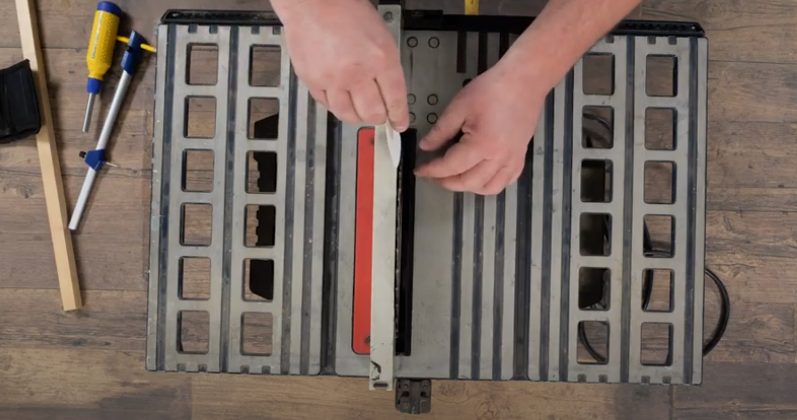 Table saw blade alignment with paper.