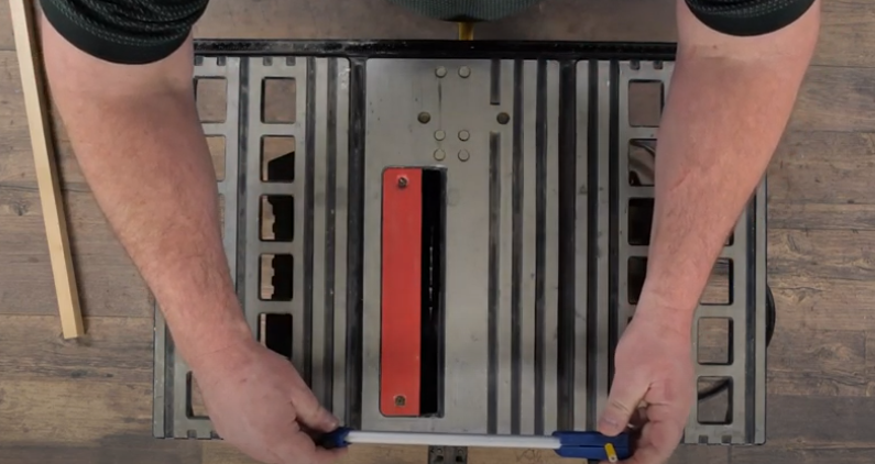 Measure alignment down the middle of the table saw.